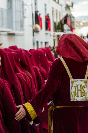 VELEZ-MALAGA, SPAIN - MARCH 25, 2018 People participating in the procession  in the Holy Week in a...