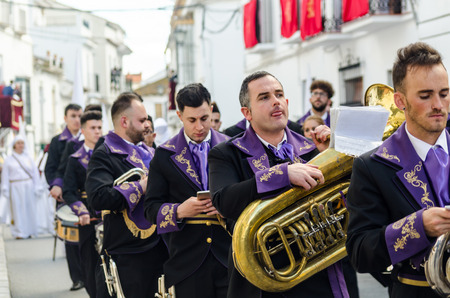 VELEZ-MALAGA, SPAIN - MARCH 25, 2018 People participating in the procession  in the Holy Week in a Spanish city, easterのeditorial素材