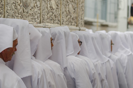 VELEZ-MALAGA, SPAIN - MARCH 25, 2018 People participating in the procession  in the Holy Week in a Spanish city, easterのeditorial素材