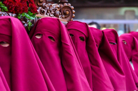 VELEZ-MALAGA, SPAIN - MARCH 24, 2018 People participating in the procession  in the Holy Week in a Spanish city, easterのeditorial素材