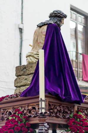 VELEZ-MALAGA, SPAIN - MARCH 24, 2018 People participating in the procession  in the Holy Week in a Spanish city, easterのeditorial素材