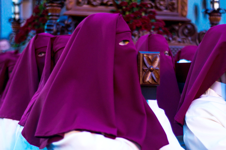 VELEZ-MALAGA, SPAIN - MARCH 24, 2018 People participating in the procession  in the Holy Week in a Spanish city, easterのeditorial素材