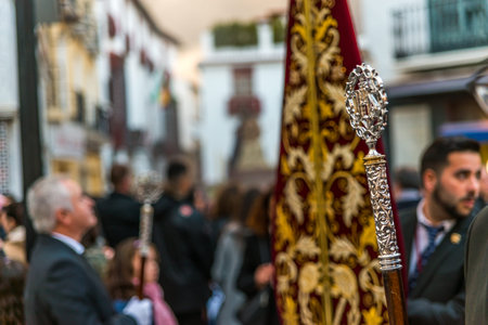 VELEZ-MALAGA, SPAIN - MARCH 24, 2018 People participating in the procession  in the Holy Week in a...