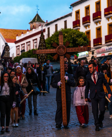 VELEZ-MALAGA, SPAIN - MARCH 24, 2018 People participating in the procession  in the Holy Week in a...