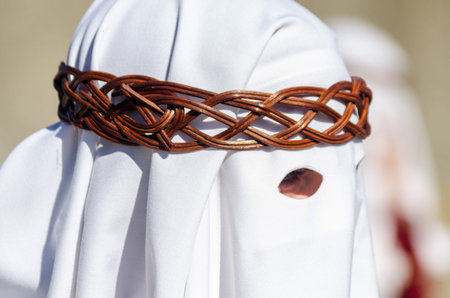 VELEZ-MALAGA, SPAIN - MARCH 27, 2018 People participating in the procession  in the Holy Week in a...