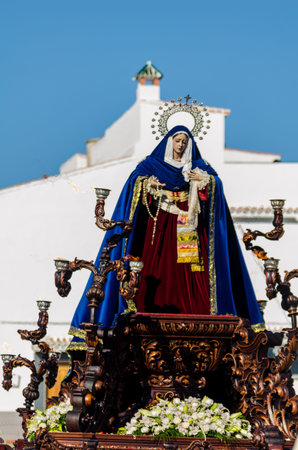 VELEZ-MALAGA, SPAIN - MARCH 27, 2018 People participating in the procession  in the Holy Week in a Spanish city, easterのeditorial素材
