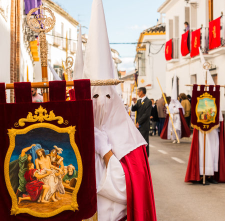 VELEZ-MALAGA, SPAIN - MARCH 25, 2018 People participating in the procession  in the Holy Week in a...