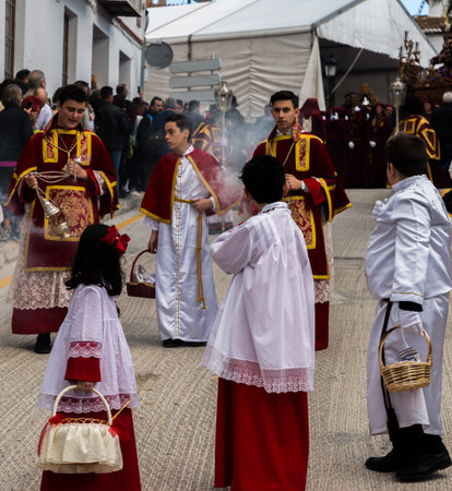 VELEZ-MALAGA, SPAIN - MARCH 25, 2018 People participating in the procession  in the Holy Week in a...