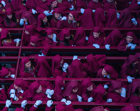 VELEZ-MALAGA, SPAIN - MARCH 25, 2018 People participating in the procession  in the Holy Week in a Spanish city, easterのeditorial素材