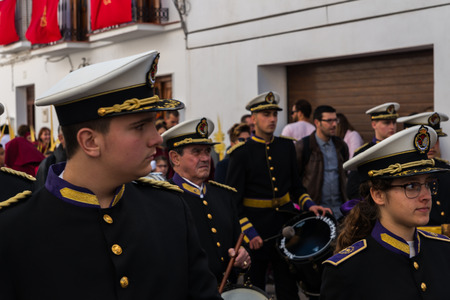 VELEZ-MALAGA, SPAIN - MARCH 25, 2018 People participating in the procession  in the Holy Week in a Spanish city, easterのeditorial素材