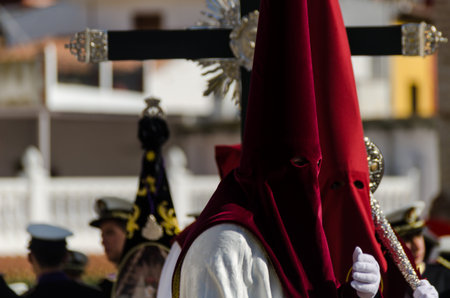 VELEZ-MALAGA, SPAIN - MARCH 29, 2018 People participating in the procession  in the Holy Week in a...