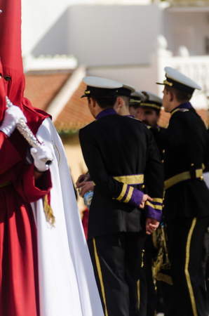 VELEZ-MALAGA, SPAIN - MARCH 29, 2018 People participating in the procession  in the Holy Week in a Spanish city, easterのeditorial素材