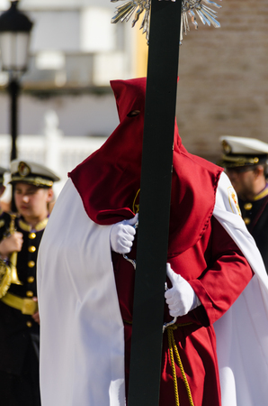 VELEZ-MALAGA, SPAIN - MARCH 29, 2018 People participating in the procession  in the Holy Week in a Spanish city, easterのeditorial素材