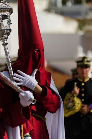 VELEZ-MALAGA, SPAIN - MARCH 29, 2018 People participating in the procession  in the Holy Week in a Spanish city, easterのeditorial素材