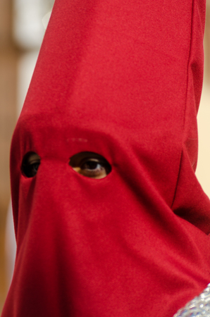 VELEZ-MALAGA, SPAIN - MARCH 29, 2018 People participating in the procession  in the Holy Week in a Spanish city, easterのeditorial素材