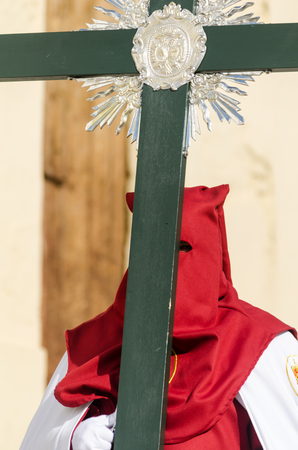 VELEZ-MALAGA, SPAIN - MARCH 29, 2018 People participating in the procession  in the Holy Week in a Spanish city, easterのeditorial素材