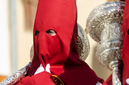 VELEZ-MALAGA, SPAIN - MARCH 29, 2018 People participating in the procession  in the Holy Week in a Spanish city, easterのeditorial素材