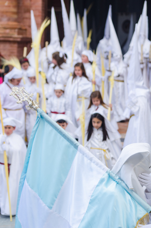 VELEZ-MALAGA, SPAIN - MARCH 25, 2018 People participating in the procession  in the Holy Week in a Spanish city, easterのeditorial素材