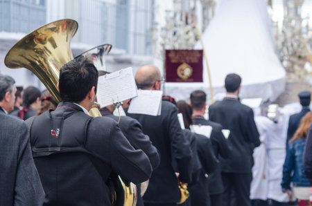VELEZ-MALAGA, SPAIN - MARCH 25, 2018 People participating in the procession  in the Holy Week in a...