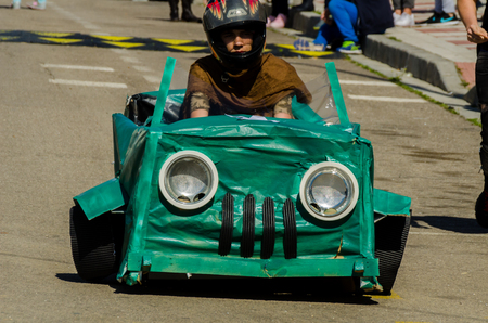 VELEZ-MALAGA, SPAIN - APRIL 14, 2018 "Autos Locos" - traditional fun involving the ride of cardboard cars, self-made vehicles, creative and cheerful eventのeditorial素材