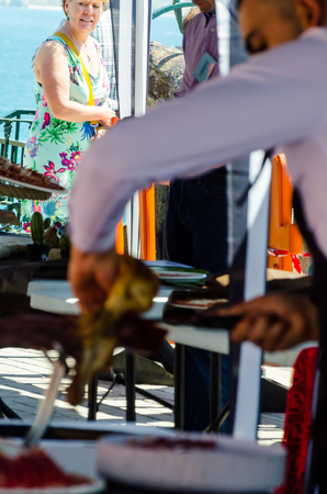 NERJA, SPAIN - APRIL 15, 2018 Traditional competition of professionals in the Jamon Serrano cutting event taking place in Nerja, Andalusia, a great demonstration of skillsのeditorial素材