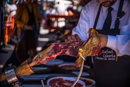 NERJA, SPAIN - APRIL 15, 2018 Traditional competition of professionals in the Jamon Serrano cutting...