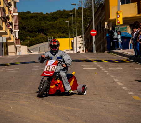 VELEZ-MALAGA, SPAIN - APRIL 14, 2018 "Autos Locos" - traditional fun involving the ride of cardboard cars, self-made vehicles, creative and cheerful eventのeditorial素材