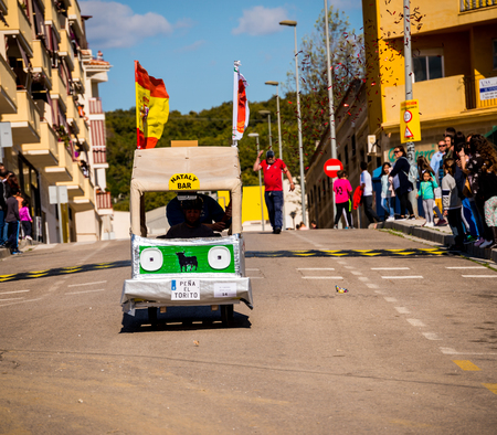 VELEZ-MALAGA, SPAIN - APRIL 14, 2018 "Autos Locos" - traditional fun involving the ride of cardboard cars, self-made vehicles, creative and cheerful eventのeditorial素材