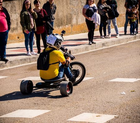VELEZ-MALAGA, SPAIN - APRIL 14, 2018 "Autos Locos" - traditional fun involving the ride of cardboard cars, self-made vehicles, creative and cheerful eventのeditorial素材