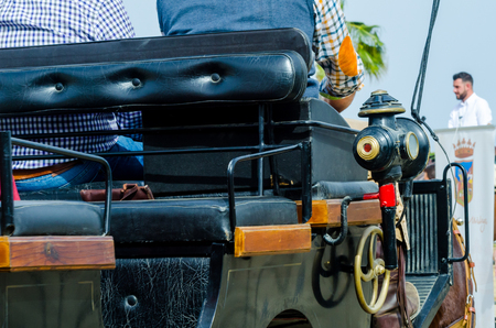 ALMAYATE, SPAIN - APRIL 22, 2018 Man driving horse with a wagon in a traditional Andalusian competition, traditional Spain contest based on the presentation of the ability to drive horse with a cart, professional work of carters with horsesのeditorial素材