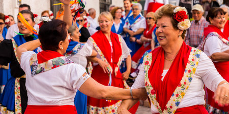 NERJA, SPAIN - MAY 04, 2018  folk dance show by a group of people on the street in a seaside Spanish townのeditorial素材