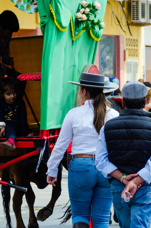 TORRE DEL MAR, SPAIN - APRIL 29, 2018 people participating in the celebration of the Catholic ceremony of transferring the holy figure in Spainのeditorial素材