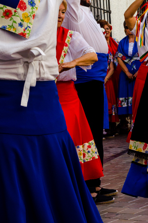 NERJA, SPAIN - MAY 04, 2018 people participating in a traditional folk dance in the street, typical Spanish costumesのeditorial素材