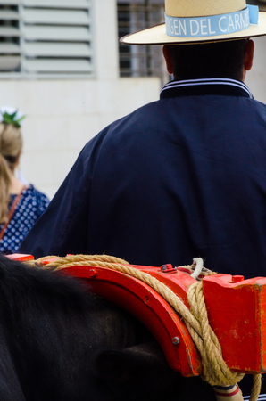 TORRE DEL MAR, SPAIN - APRIL 29, 2018 people participating in the celebration of the Catholic ceremony of transferring the holy figure in Spainのeditorial素材