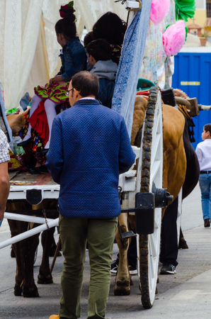 TORRE DEL MAR, SPAIN - APRIL 29, 2018 people participating in the celebration of the Catholic ceremony of transferring the holy figure in Spainのeditorial素材