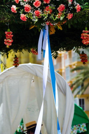 TORRE DEL MAR, SPAIN - APRIL 29, 2018 people participating in the celebration of the Catholic ceremony of transferring the holy figure in Spainのeditorial素材