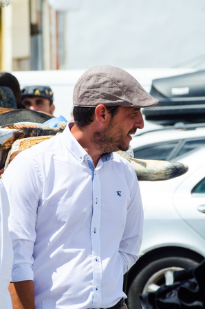 TORRE DEL MAR, SPAIN - APRIL 29, 2018 people participating in the celebration of the Catholic ceremony of transferring the holy figure in Spainのeditorial素材