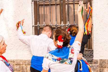 NERJA, SPAIN - MAY 04, 2018 people participating in a traditional folk dance in the street, typical Spanish costumesのeditorial素材