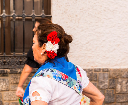 NERJA, SPAIN - MAY 04, 2018  folk dance show by a group of people on the street in a seaside Spanish townのeditorial素材