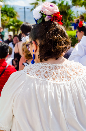 TORRE DEL MAR, SPAIN - APRIL 29, 2018 people participating in the celebration of the Catholic ceremony of transferring the holy figure in Spainのeditorial素材