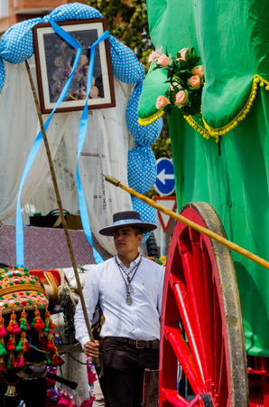TORRE DEL MAR, SPAIN - APRIL 29, 2018 people participating in the celebration of the Catholic ceremony of transferring the holy figure in Spainのeditorial素材