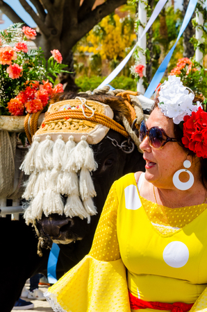 TORRE DEL MAR, SPAIN - APRIL 29, 2018 people participating in the celebration of the Catholic ceremony of transferring the holy figure in Spainのeditorial素材