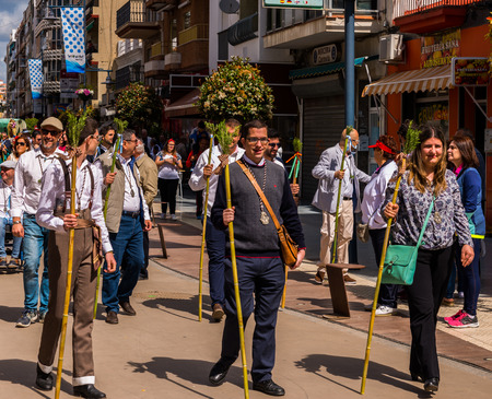 TORRE DEL MAR, SPAIN - APRIL 29, 2018 people participating in the celebration of the Catholic ceremony of transferring the holy figure in Spainのeditorial素材