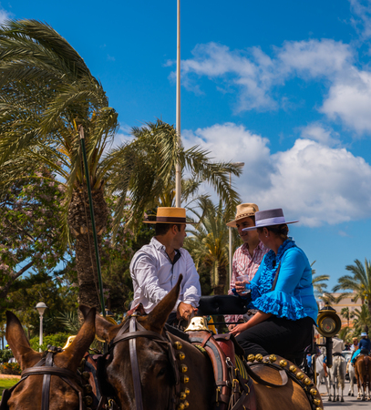 TORRE DEL MAR, SPAIN - APRIL 29, 2018 people participating in the celebration of the Catholic ceremony of transferring the holy figure in Spainのeditorial素材