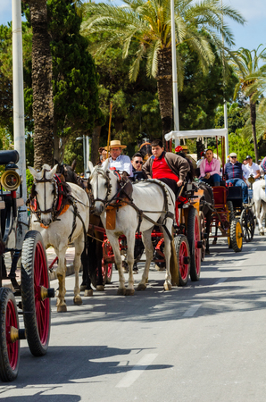 TORRE DEL MAR, SPAIN - APRIL 29, 2018 people participating in the celebration of the Catholic ceremony of transferring the holy figure in Spainのeditorial素材