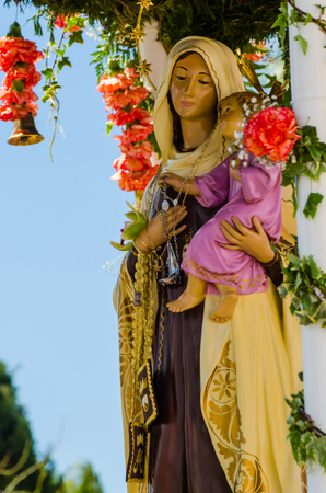 TORRE DEL MAR, SPAIN - APRIL 29, 2018 people participating in the celebration of the Catholic ceremony of transferring the holy figure in Spainのeditorial素材