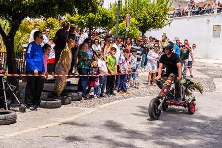 FRIGILIANA, SPAIN - MAY 13, 2018 "Autos Locos"  traditional fun involving the ride of cardboard cars in small spanish town, self-made vehicles, creative and cheerful eventのeditorial素材