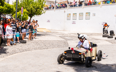 FRIGILIANA, SPAIN - MAY 13, 2018 "Autos Locos"  traditional fun involving the ride of cardboard cars in small spanish town, self-made vehicles, creative and cheerful eventのeditorial素材