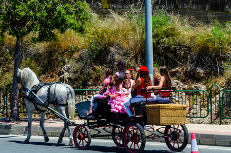NERJA, SPAIN - 15 MAY, 2018 people participating in the Catholic ceremony of transferring the holy figure in Spainのeditorial素材