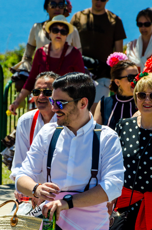 NERJA, SPAIN - 15 MAY, 2018 people participating in the Catholic ceremony of transferring the holy figure in Spainのeditorial素材
